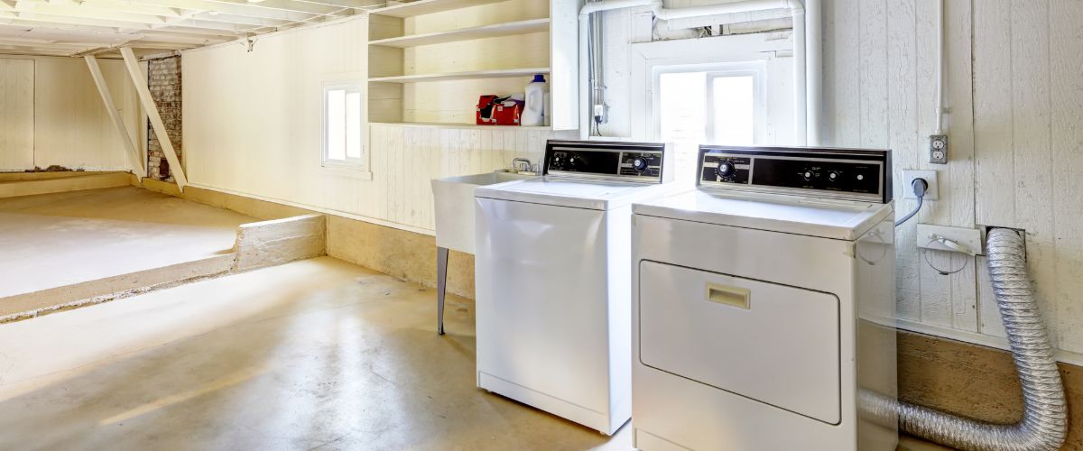 Egress Windows behind laundry machines in Quincy